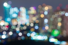 Blurred bokeh night life cityscape for club venue and urban city life.  Night time out on the town for big party with friends and entertainment.  Happiness and fun times.