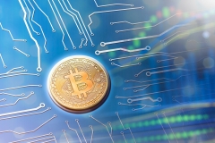Bitcoin currency powering new currency system of the digital age. Mainboard computer circuit concept.