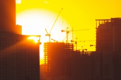 Building onstruction concept with lens flare and sunset.  Business growth and design and planning.