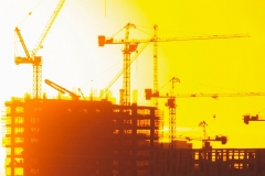 Building onstruction concept with lens flare and sunset.  Business growth and design and planning.