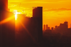 Building onstruction concept with lens flare and sunset.  Business growth and design and planning.