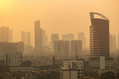 Jakarta city skyline.  Indonesian travel and sightsee in urban central city with highrise buildings and bright light.