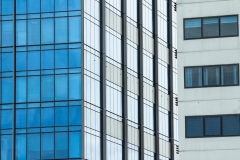 Modern steel and glass facade for office highrise buildings.  Construction underway for the new modern and contemporary skyscraper.