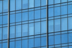 Modern steel and glass facade for office highrise buildings.  Construction underway for the new modern and contemporary skyscraper.