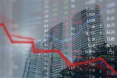 Spiraling down trend loss of investor money in stock market as investors bail out of company stock.  Big business with skyscrapers and major financial crisis.
