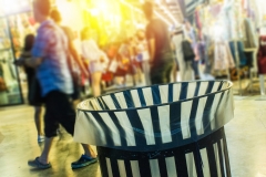 Blurred background and people.  Trash can in evening for waste bin throwing away garbage concept.