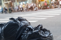 Trash in city on sidewalk for landfill cocept.