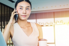 Business woman on a phone call in office.  Communication and contact concept.