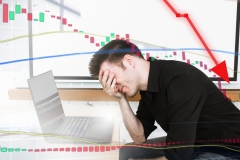 Man disappointed as stock price falls and money is lost.  Stress and anger for day-trader.  High risk.