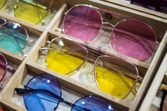 Sunglass shop and different apparel for eyes with colorful accessories and trendy lenses.